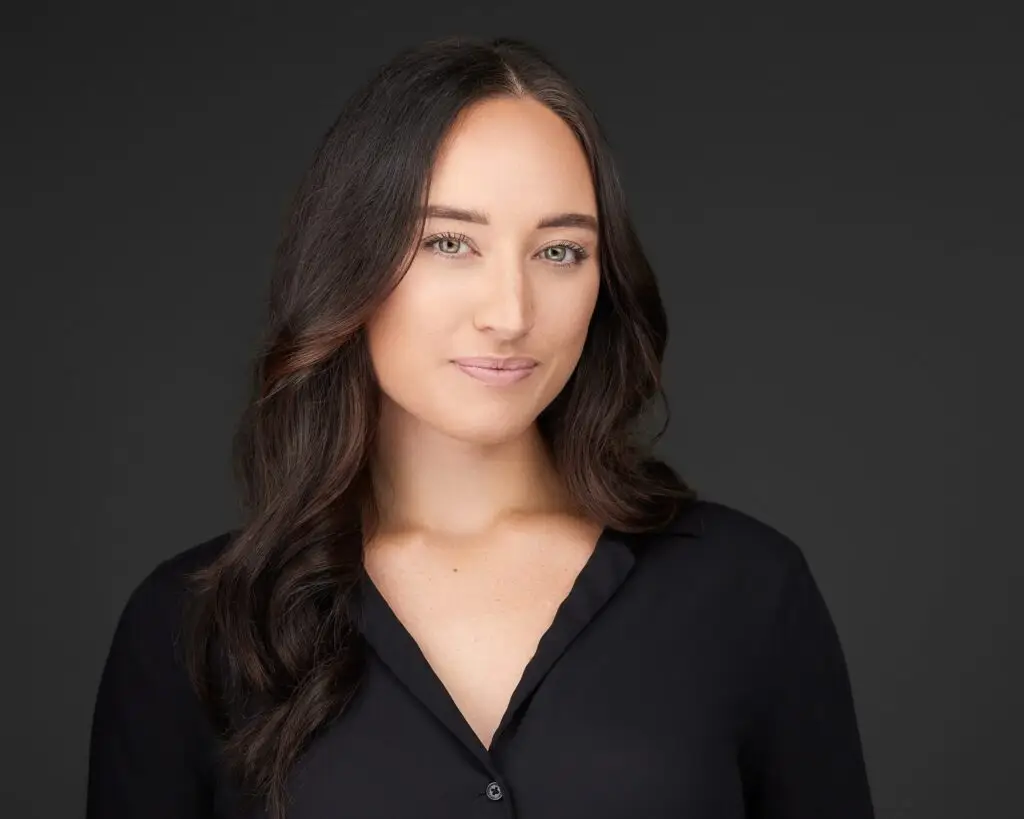 Business woman professional headshot on dark background
